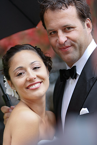 couple smile for vancouver wedding photography in the garden at the Fairmont in Whistler BC